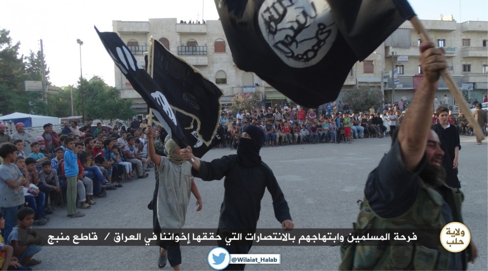 ISIL militants in (Manbij, Aleppo) Rejoicing over the capture of Iraqi city of Mosul. 